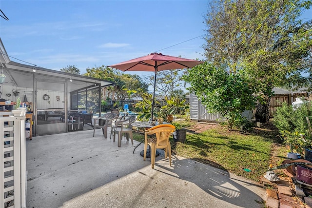 view of patio / terrace with a sunroom