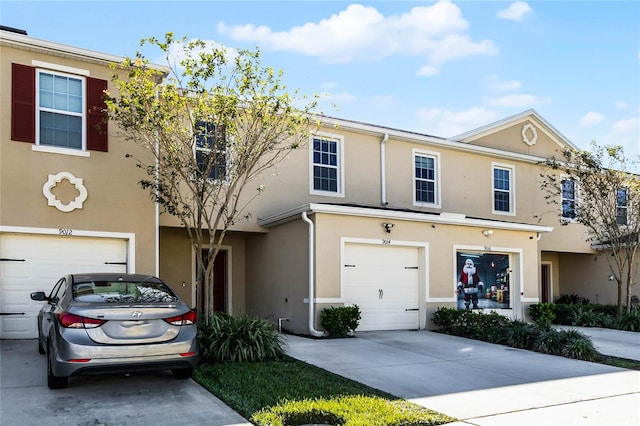 multi unit property featuring a garage