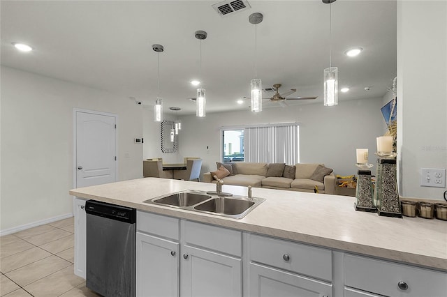 kitchen with stainless steel dishwasher, ceiling fan, sink, pendant lighting, and light tile patterned floors