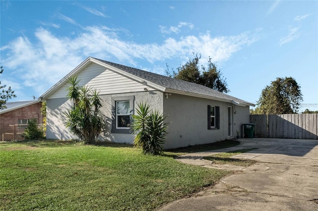 view of property exterior featuring a lawn