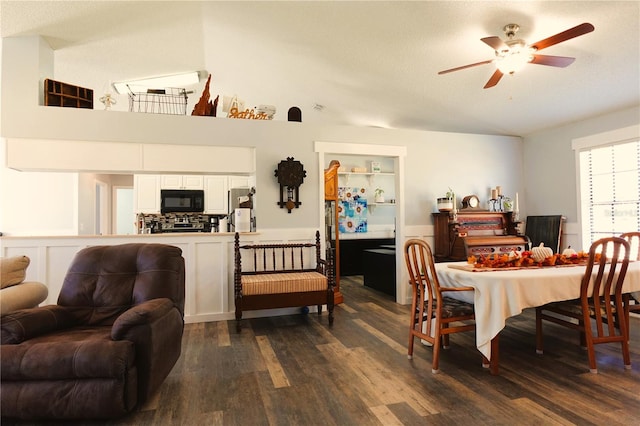 dining area with a textured ceiling, dark hardwood / wood-style flooring, and ceiling fan