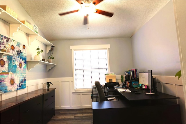 office area featuring a textured ceiling, ceiling fan, and dark wood-type flooring