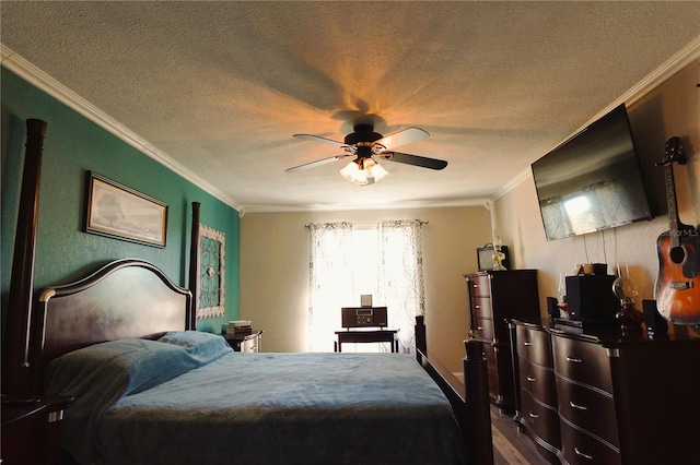 bedroom featuring wood-type flooring, a textured ceiling, ceiling fan, and ornamental molding