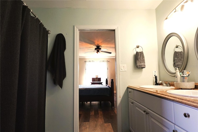 bathroom with ceiling fan, hardwood / wood-style floors, and vanity