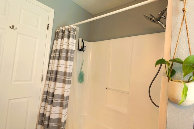 bathroom with curtained shower