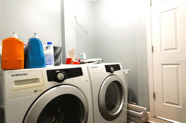 laundry room featuring washer and clothes dryer