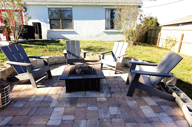 view of patio / terrace featuring a fire pit