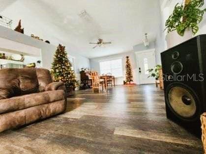 living room featuring ceiling fan