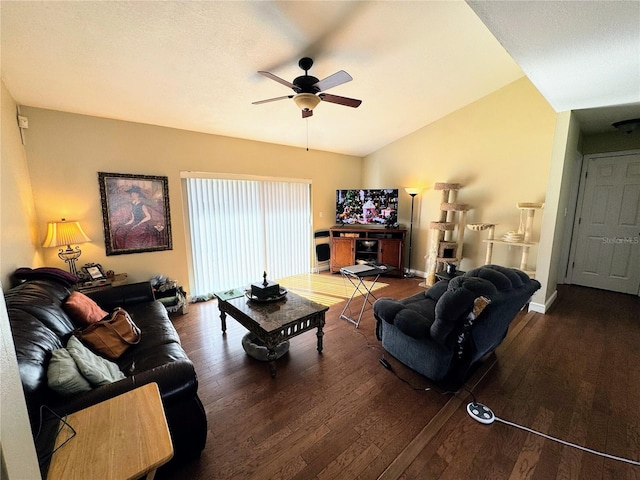 living room featuring dark hardwood / wood-style floors, ceiling fan, and lofted ceiling