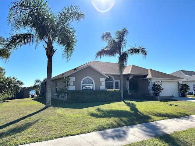 single story home with a garage and a front yard