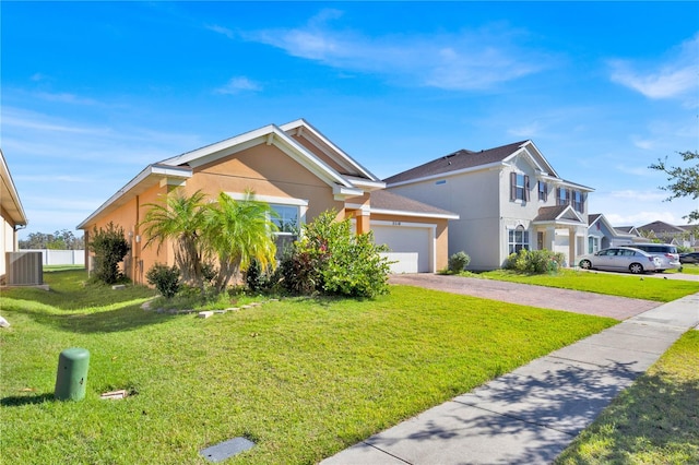 view of front facade with a garage and a front lawn