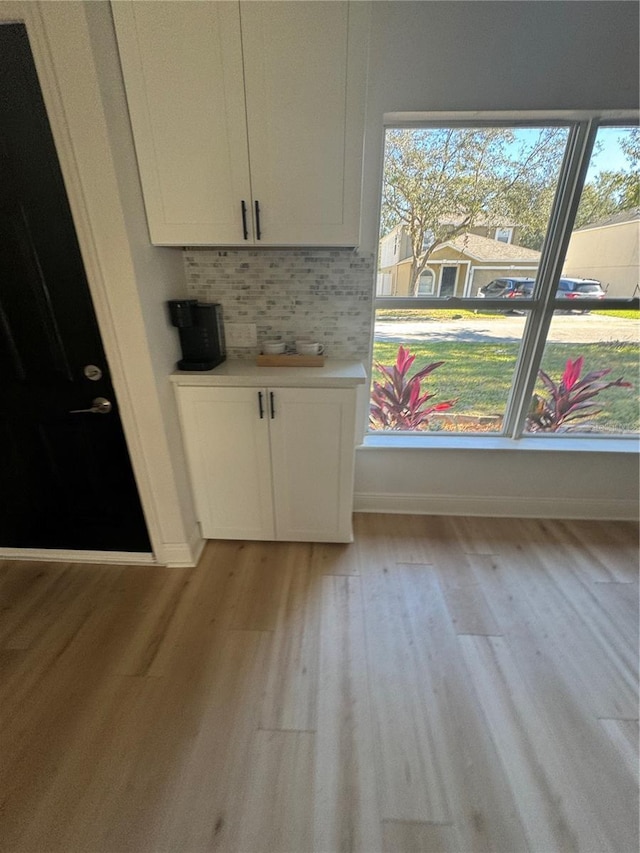 unfurnished dining area with light wood-type flooring