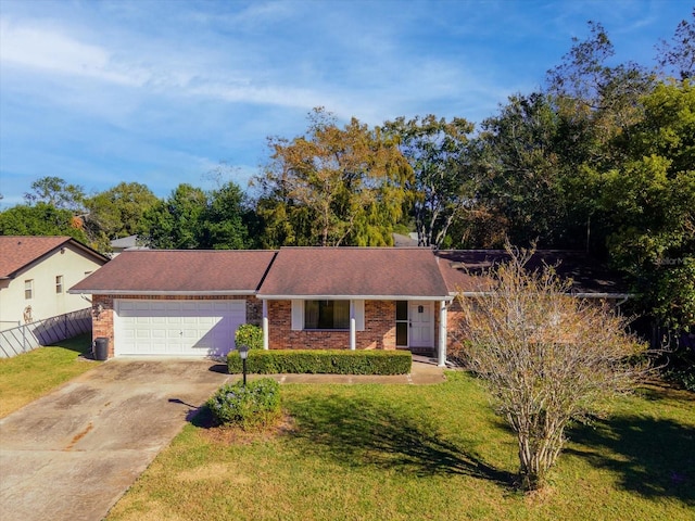 ranch-style house with a garage and a front yard