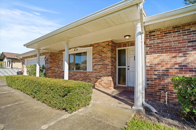 view of exterior entry featuring a garage