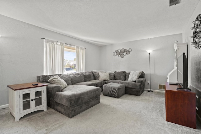 living room with light carpet and a textured ceiling