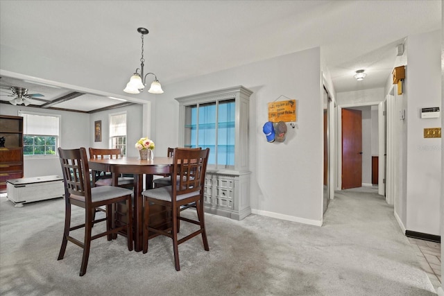 1639 Templewood Ave, Deltona, FL 32725 - carpeted dining area featuring baseboards, a chandelier, and a ceiling fan