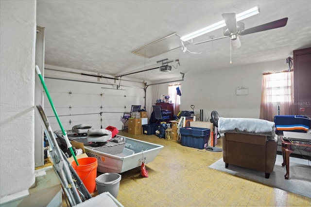 garage with a garage door opener and ceiling fan