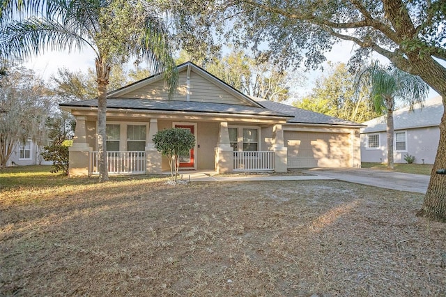 view of front facade with covered porch and a garage