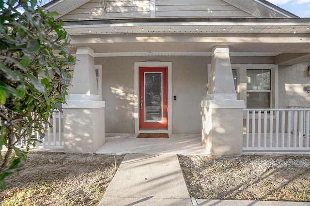 property entrance with covered porch