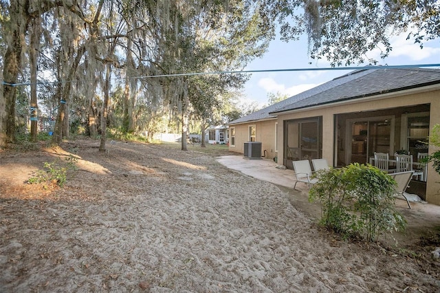 view of yard with central AC