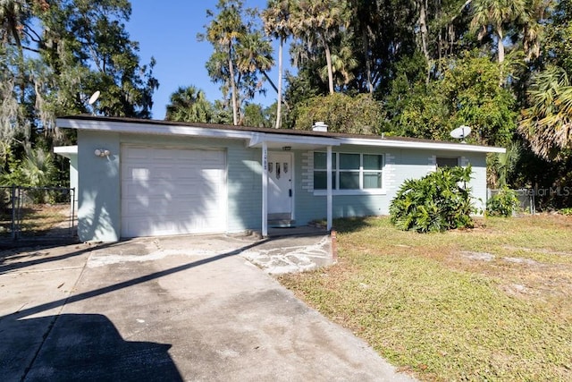 1068 N St, Daytona Beach, FL 32114 - ranch-style home with a garage and driveway