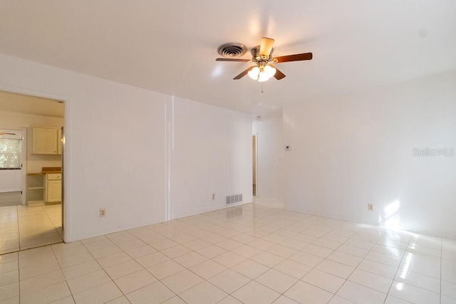 1068 N St, Daytona Beach, FL 32114 - unfurnished room with a ceiling fan and light tile patterned floors