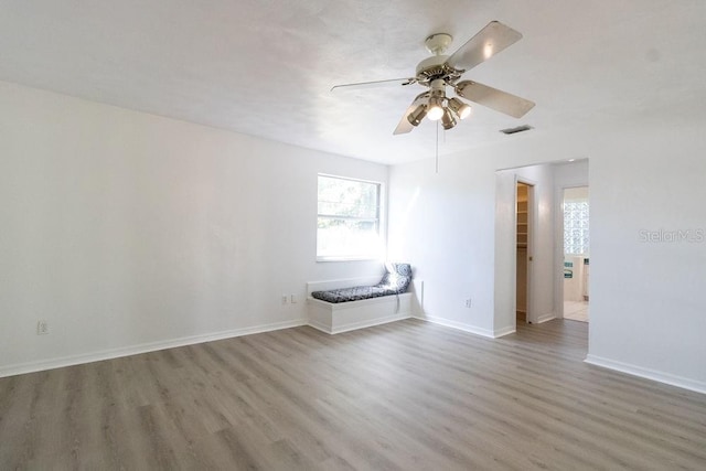 1068 N St, Daytona Beach, FL 32114 - spare room featuring wood finished floors, ceiling fan, and baseboards