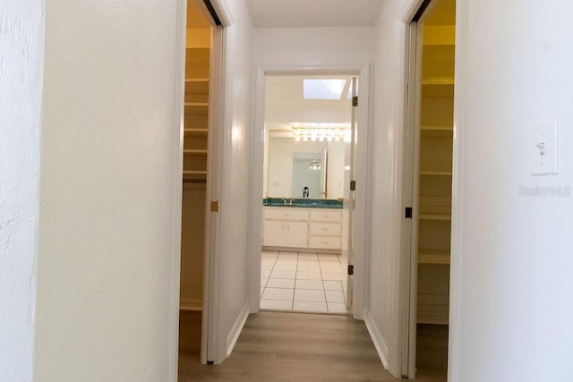 corridor featuring light hardwood / wood-style floors