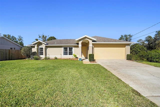 ranch-style home featuring a garage and a front yard