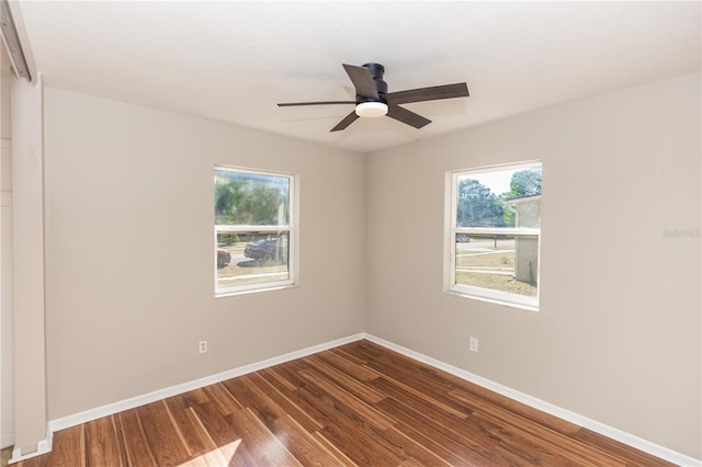 unfurnished room featuring dark hardwood / wood-style floors and ceiling fan