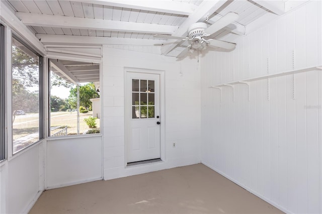 unfurnished sunroom with vaulted ceiling with beams and ceiling fan