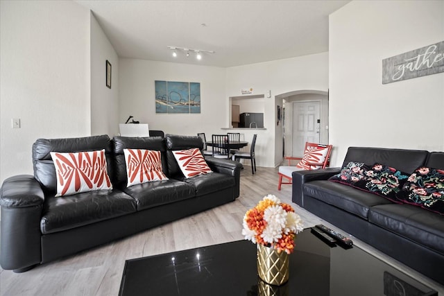 living room with light hardwood / wood-style flooring