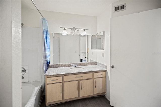 bathroom with shower / bath combo, vanity, and hardwood / wood-style flooring