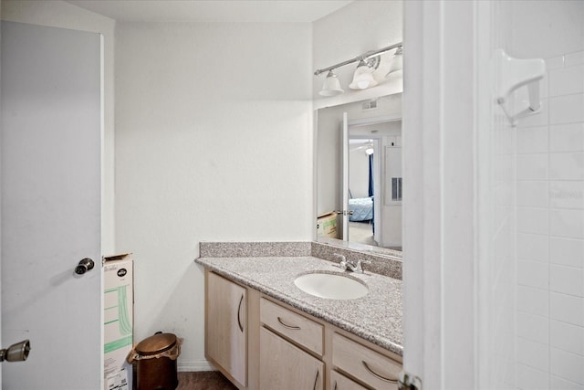 bathroom featuring vanity and walk in shower