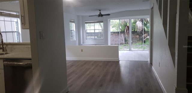 interior space featuring ceiling fan, dark wood-type flooring, and sink