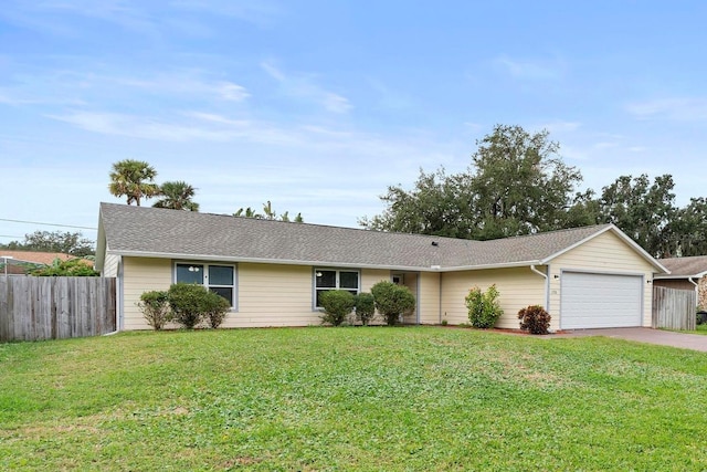 ranch-style house with a front lawn and a garage