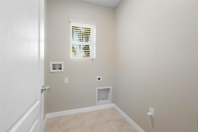 clothes washing area featuring electric dryer hookup, hookup for a washing machine, and light tile patterned flooring