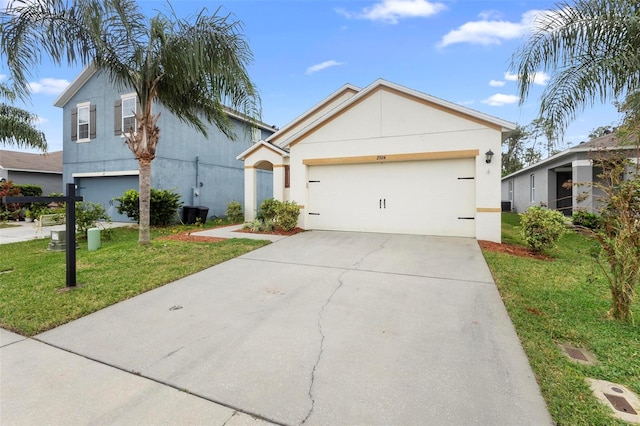 view of front of house featuring a garage and a front yard