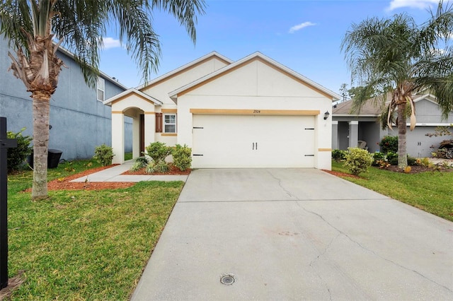 view of front facade with a garage and a front lawn