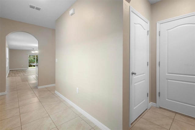 hall with light tile patterned flooring