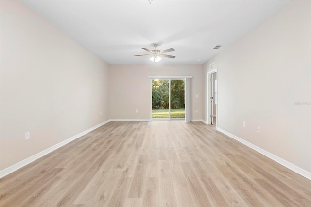 empty room featuring ceiling fan and light hardwood / wood-style flooring