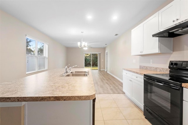 kitchen featuring pendant lighting, black electric range oven, sink, white cabinets, and a kitchen island with sink