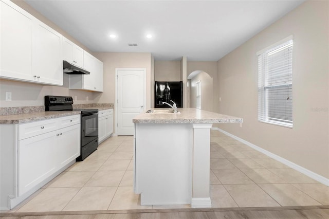 kitchen featuring white cabinetry, sink, a kitchen island with sink, and black appliances