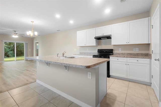 kitchen featuring a center island with sink, white cabinets, and black range with electric cooktop