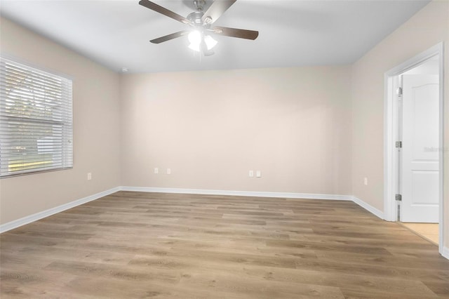 empty room featuring ceiling fan and light hardwood / wood-style flooring