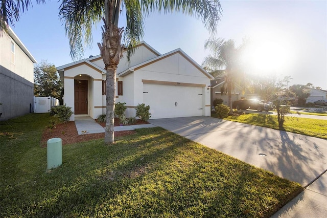 view of front of home featuring a garage and a front yard