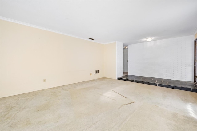 carpeted spare room featuring ornamental molding