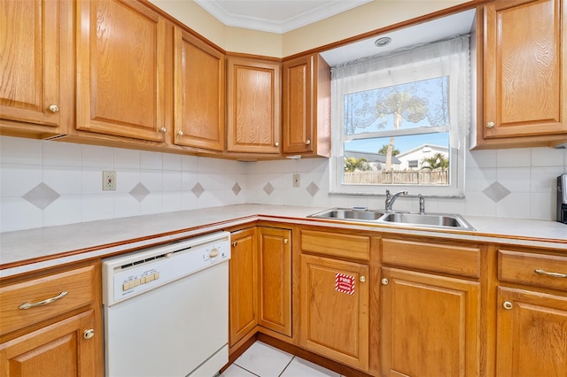 kitchen with sink, crown molding, decorative backsplash, and dishwasher