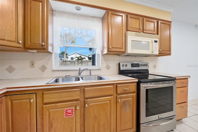 kitchen with tasteful backsplash, sink, light tile patterned floors, and stainless steel electric range oven