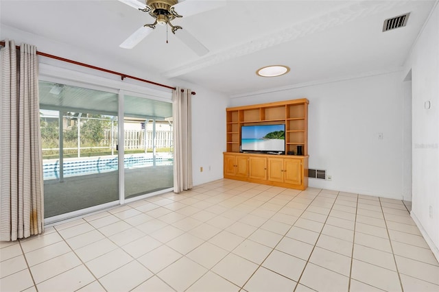 unfurnished living room featuring ceiling fan and light tile patterned floors